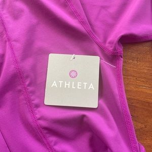 Athleta pullover with approx91/4 front zipper and gathered sides .  XS